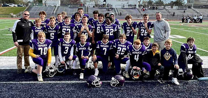 The Norwich modified football team celebrates an undefeated 2023 season